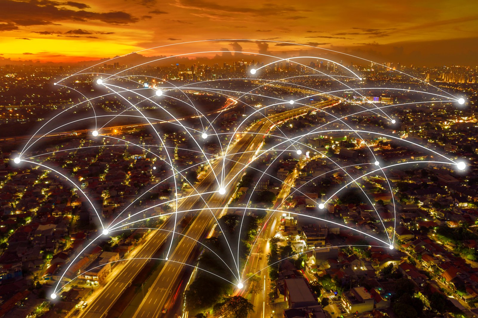 Aerial view of Jakarta cityscape with connection network at dusk time